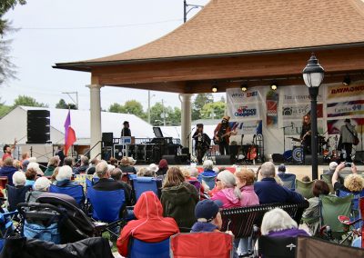 A large crowd gathers to hear music at the Colorscape Chenango Arts Festival
